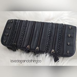 Cute black clutch with small skulls on it